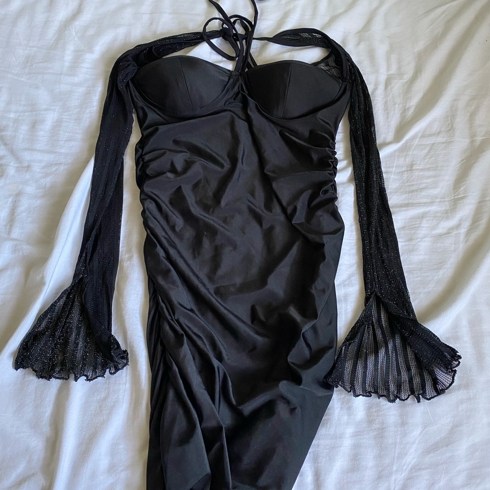 Medium black part backless dress with sparkly mesh long sleeves.